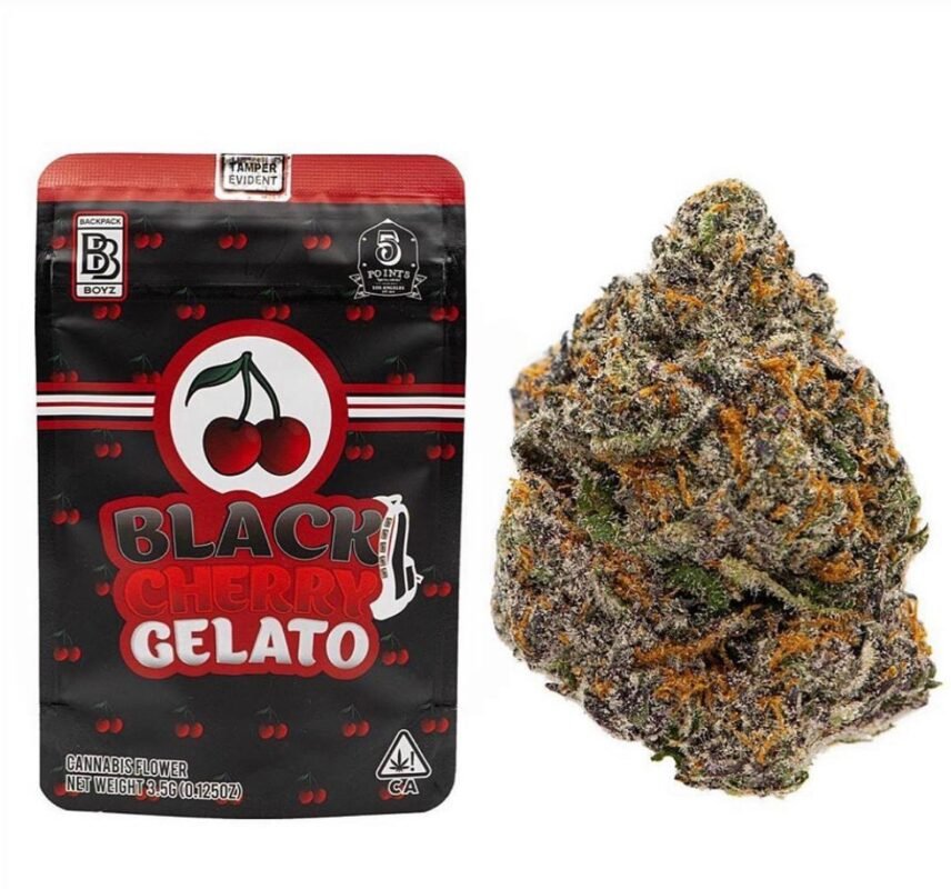 Elegant black bag of Black Cherry Gelato 14g with fresh cherries on a dark background
