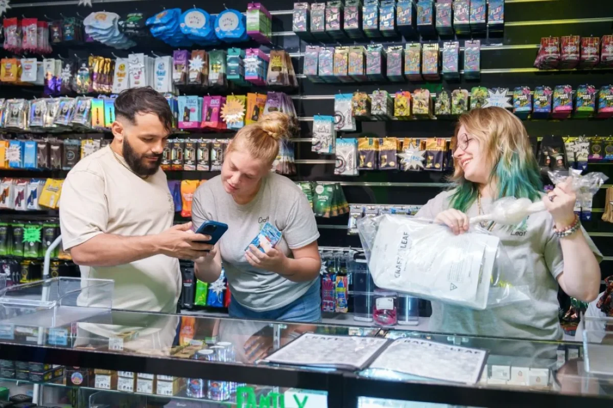 Active consumers searching for top marijuana dispensaries near me options inside a modern digital showroom.