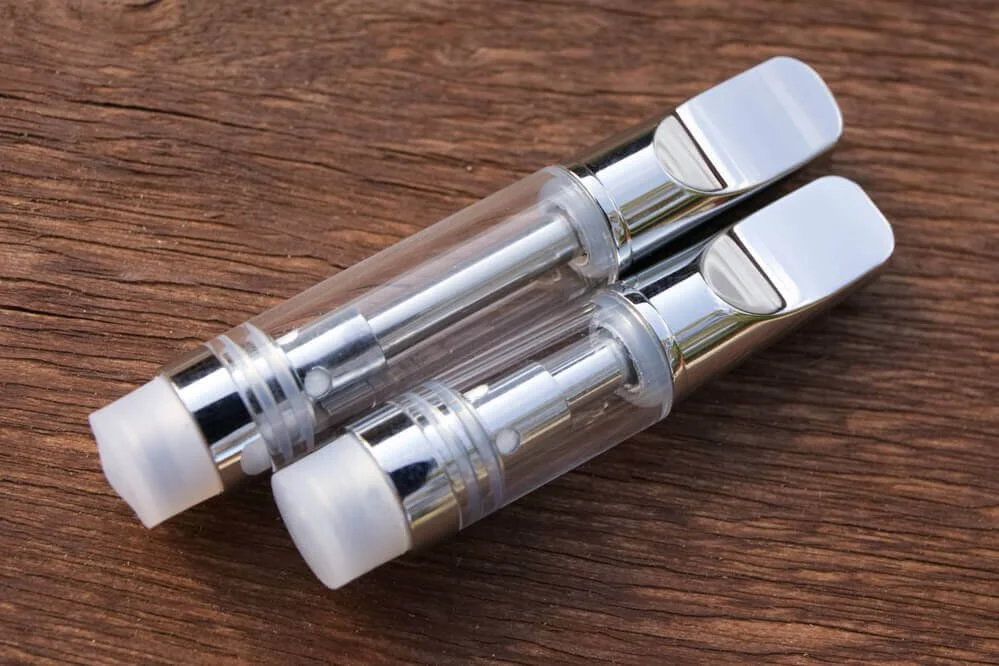 Premium vape cartridges displaying the ceramic heating elements used to prevent combustion.