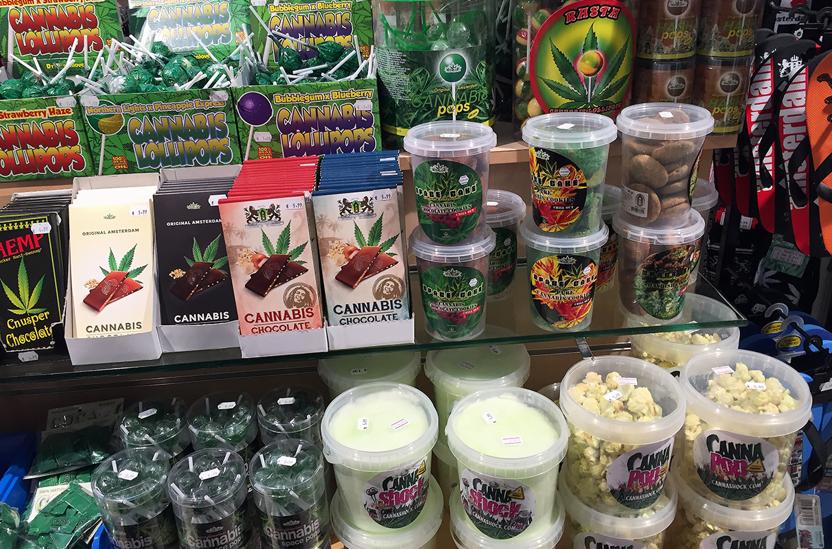 Delicious laboratory-tested edibles uk displayed on a clean wooden plate beside organic ingredients from Prime THC Supply