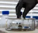 Premium bottle of pure thc p distillate resting on a modern laboratory testing table